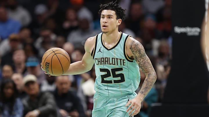 Charlotte Hornets guard KJ Simpson brings the ball up the court during the second half of play against the Denver Nuggets at Spectrum Center.