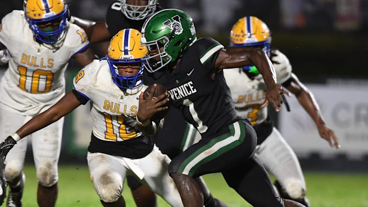 Venice High wide receiver Winston Watkins (#1) is pursued by Miami Northwestern defenders. The Venice High Indians hosted the Miami Northwestern Bulls in a non-conference game Friday evening, Aug. 30, 2024.