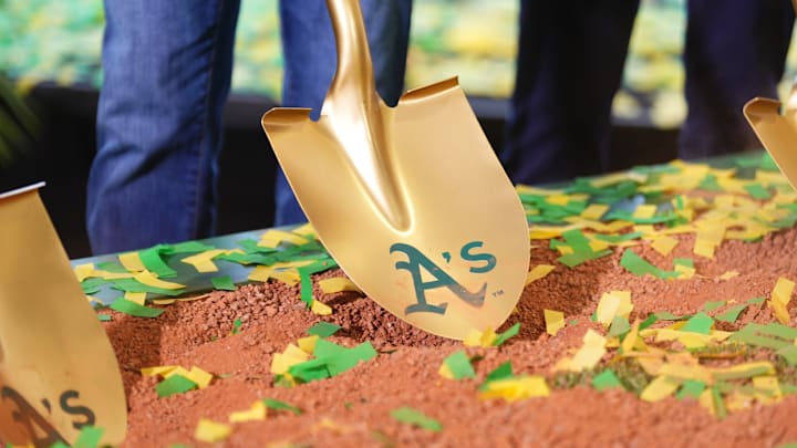 Gold shovel with Athletics on it in the dirt as the team's ceremonial groundbreaking in Las Vegas