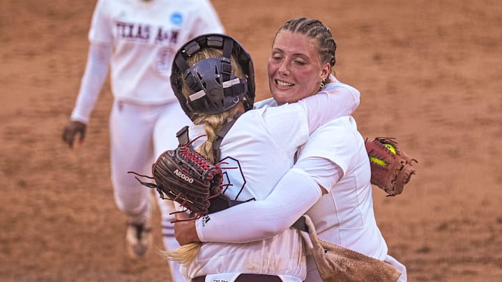 Texas A&M catcher Julia Cottrill (42) hugs pitcher Emiley Kennedy (11) after beating Texas in the NCAA Super Regional opener at Red & Charline McCombs Field on Friday, May 24, 2024 in Austin.