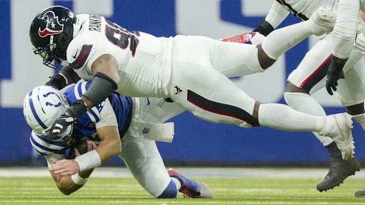 Nov 30, 2025; Indianapolis, Indiana, USA; Houston Texans defensive tackle Sheldon Rankins (90) tackles Indianapolis Colts quarterback Daniel Jones (17) during a game at Lucas Oil Stadium. Mandatory Credit: Grace Hollars-USA TODAY Network via Imagn Images