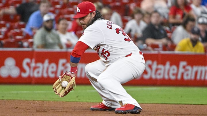 Jul 30, 2024; St. Louis, Missouri, USA;  St. Louis Cardinals third baseman Brandon Crawford (35) fields a ground ball against the Texas Rangers during the ninth inning at Busch Stadium. Mandatory Credit: Jeff Curry-USA TODAY Sports