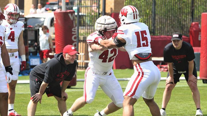 Tyler Jansey (42) and Sebastian Cheeks (15) go through a drill as defensive coordinator Mike Tressel watches before the team's intrasquad scrimmage on the field north of Camp Randall Stadium in Madison, Wisconsin on Saturday April 27, 2024. Tyler Jansey (42) and Sebastian Cheeks (15) go through a drill as defensive coordinator Mike Tressel watches before the team's intrasquad scrimmage on the field north of Camp Randall Stadium in Madison, Wisconsin on Saturday April 27, 2024.