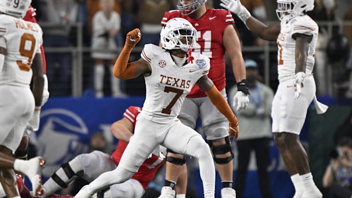 Jan 10, 2025; Arlington, Texas, USA; Texas Longhorns defensive back Jahdae Barron (7) celebrates after a sack during the second quarter of the College Football Playoff semifinal against the Ohio State Buckeyes in the Cotton Bowl at AT&T Stadium. Mandatory Credit: Jerome Miron-Imagn Images
