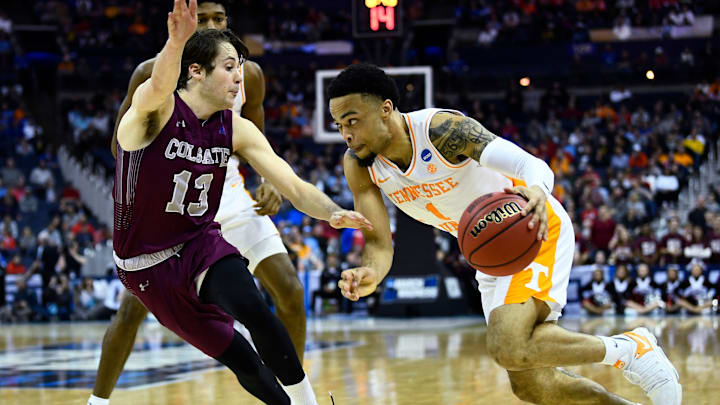 Tennessee guard Lamonte Turner (1) drives past Colgate guard Jack Ferguson (13) during their first round game of the NCAA Tournament at Nationwide Arena in Columbus, Ohio, on Friday, March 22, 2019. 

Kns Utbasketball Vs Colgate Ncaa Tournament Bp Jpg