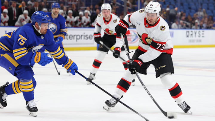 Nov 5, 2024; Buffalo, New York, USA;  Buffalo Sabres defenseman Connor Clifton (75) tries to block a shot by Ottawa Senators left wing Noah Gregor (73) during the first period at KeyBank Center. Mandatory Credit: Timothy T. Ludwig-Imagn Images