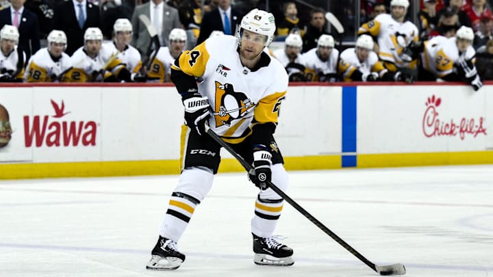 Apr 11, 2025; Newark, New Jersey, USA; Pittsburgh Penguins defenseman Matt Grzelcyk (24) controls the puck during the third period against the New Jersey Devils at Prudential Center. Mandatory Credit: John Jones-Imagn Images