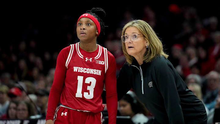 Wisconsin Badgers guard Ronnie Porter (13) speaks with head coach Robin Pingeton in the first half of the NCAA basketball game at Value City Arena on Thursday, Jan. 29, 2026 in Columbus, Ohio.