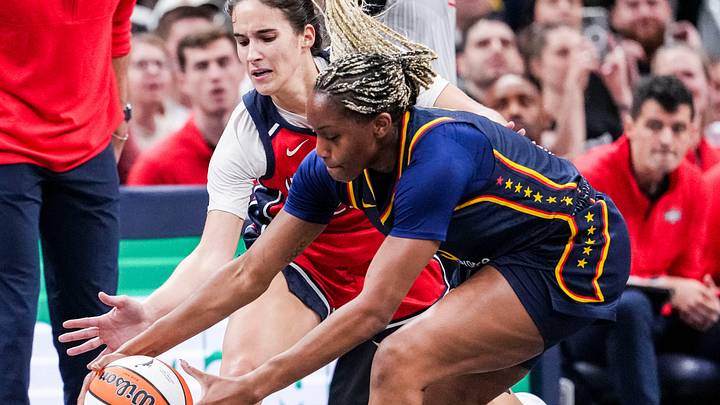 Washington Mystics Sonia Citron (22) and Indiana Fever Yvonne Ejim (15) go for the ball Saturday, May 3, 2025, during a preseason game between the Indiana Fever and the Washington Mystics at Gainbridge Fieldhouse in Indianapolis. The Indiana Fever defeated the Washington Mystics in overtime, 79-74.