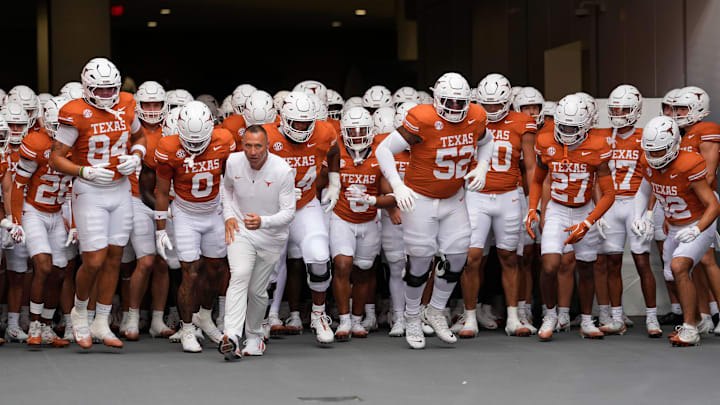 Sep 20, 2025; Austin, Texas, USA; Texas Longhorns head coach Steve Sarkisian leads his team on to the field before a game against the Sam Houston State Bearkats at Darrell K Royal-Texas Memorial Stadium. Mandatory Credit: Scott Wachter-Imagn Images