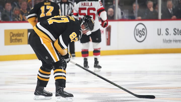Feb 4, 2025; Pittsburgh, Pennsylvania, USA;  Pittsburgh Penguins center Sidney Crosby (87) reacts after suffering an apparent injury against the New Jersey Devils during the third period Crosby would return later in the period. at PPG Paints Arena. Mandatory Credit: Charles LeClaire-Imagn Images