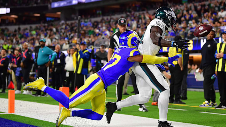Nov 24, 2024; Inglewood, California, USA; Philadelphia Eagles wide receiver A.J. Brown (11) loses the ball against Los Angeles Rams safety Quentin Lake (37) during the first half at SoFi Stadium. Mandatory Credit: Gary A. Vasquez-Imagn Images