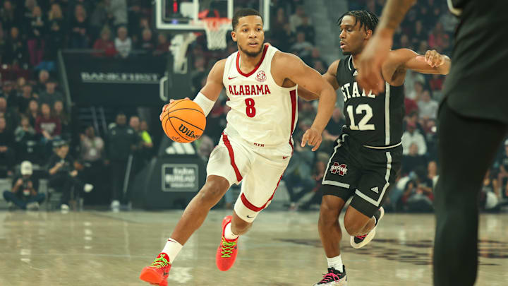 Jan 29, 2025; Starkville, Mississippi, USA; Alabama Crimson Tide guard Chris Youngblood (8) drives to the basket against Mississippi State Bulldogs guard Josh Hubbard (12) during the first half at Humphrey Coliseum. Mandatory Credit: Wesley Hale-Imagn Images Jan 29, 2025; Starkville, Mississippi, USA; Alabama Crimson Tide guard Chris Youngblood (8) drives to the basket against Mississippi State Bulldogs guard Josh Hubbard (12) during the first half at Humphrey Coliseum. Mandatory Credit: Wesley Hale-Imagn Images