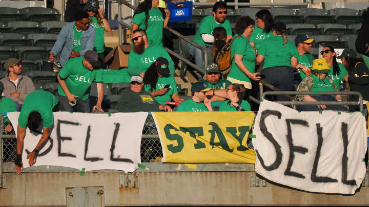 Apr 28, 2023; Oakland, California, USA; Oakland Athletics fan hang signs reading sell and stay during the second inning against the Cincinnati Reds at Oakland Coliseum. Mandatory Credit: Kelley L Cox-USA TODAY Sports Apr 28, 2023; Oakland, California, USA; Oakland Athletics fan hang signs reading sell and stay during the second inning against the Cincinnati Reds at Oakland Coliseum. Mandatory Credit: Kelley L Cox-USA TODAY Sports