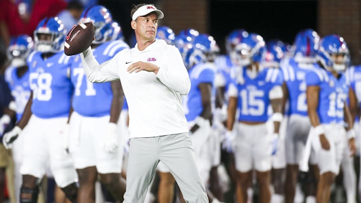 Nov 15, 2025; Oxford, Mississippi, USA; Mississippi Rebels head coach Lane Kiffin throws a football during pregame warmups against the Florida Gators at Vaught-Hemingway Stadium. Mandatory Credit: Petre Thomas-Imagn Images Nov 15, 2025; Oxford, Mississippi, USA; Mississippi Rebels head coach Lane Kiffin throws a football during pregame warmups against the Florida Gators at Vaught-Hemingway Stadium. Mandatory Credit: Petre Thomas-Imagn Images