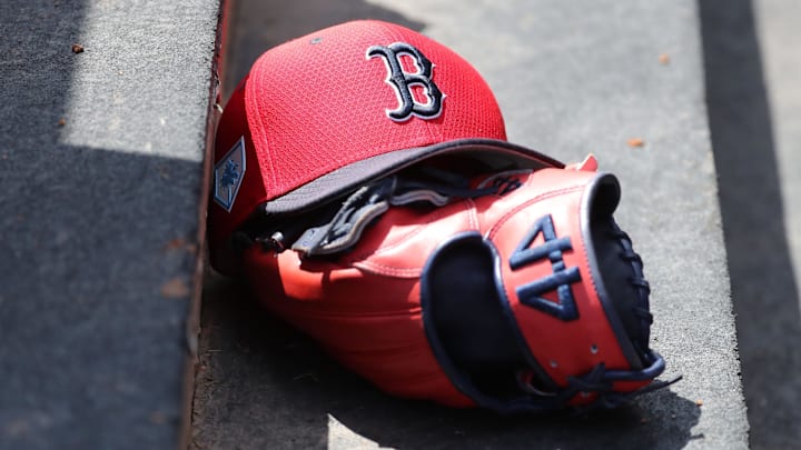 Mar 15, 2019; Tampa, FL, USA; Boston Red Sox hat and glove lay in the dugout  at George M. Steinbrenner Field.