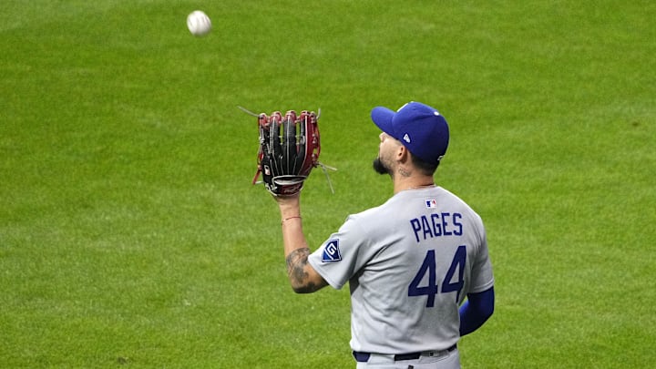 Oct 14, 2025; Milwaukee, Wisconsin, USA; Los Angeles Dodgers center fielder Andy Pages (44) makes a catch against the Milwaukee Brewers in the fourth inning during game two of the NLCS round for the 2025 MLB playoffs at American Family Field. Mandatory Credit: Michael McLoone-Imagn Images