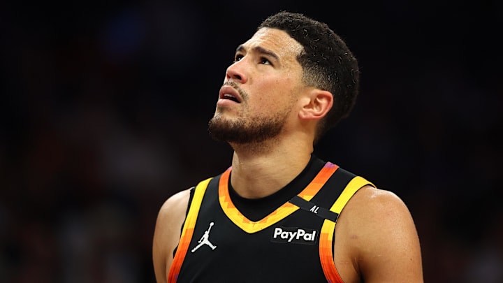 Apr 9, 2025; Phoenix, Arizona, USA; Phoenix Suns guard Devin Booker (1) reacts after a play against the Oklahoma City Thunder during the first half at Footprint Center. Mandatory Credit: Mark J. Rebilas-Imagn Images