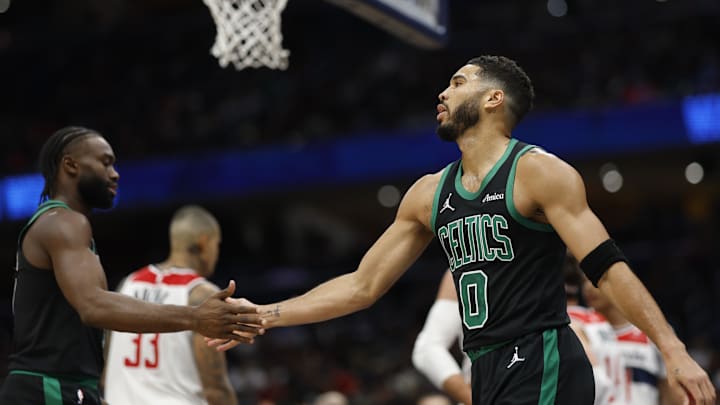 Oct 24, 2024; Washington, District of Columbia, USA; Boston Celtics forward Jayson Tatum (0) celebrates with Celtics guard Jaylen Brown (7) against the Washington Wizards in the first half at Capital One Arena. Mandatory Credit: Geoff Burke-Imagn Images