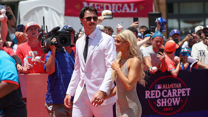 Jul 16, 2024; Arlington, Texas, USA; Pittsburgh Pirates pitcher Paul Skenes walks the red carpet with LSU gymnast and girlfriend Livvy Dunne before the 2024 MLB All-Star game at Globe Life Field. Mandatory Credit: Kevin Jairaj-Imagn Images