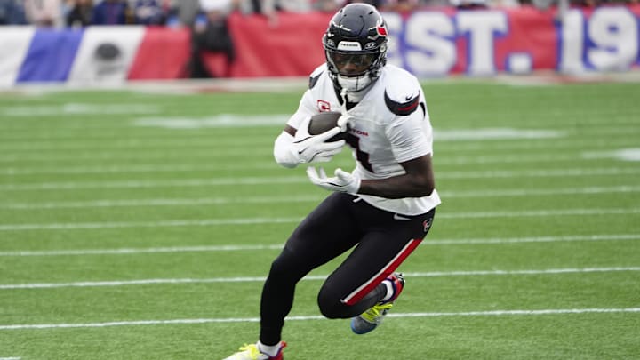 Oct 13, 2024; Foxborough, Massachusetts, USA; Houston Texans wide receiver Stefon Diggs (1) runs with the ball after making a catch against the New England Patriots during the first half at Gillette Stadium. Mandatory Credit: Gregory Fisher-Imagn Images