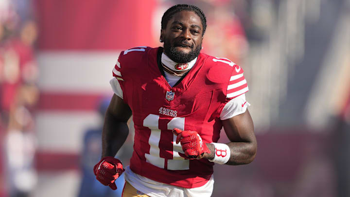 Sep 9, 2024; Santa Clara, California, USA; San Francisco 49ers wide receiver Brandon Aiyuk (11) is introduced to the crowd before the game against the New York Jets at Levi's Stadium. Mandatory Credit: Darren Yamashita-Imagn Images Sep 9, 2024; Santa Clara, California, USA; San Francisco 49ers wide receiver Brandon Aiyuk (11) is introduced to the crowd before the game against the New York Jets at Levi's Stadium. Mandatory Credit: Darren Yamashita-Imagn Images
