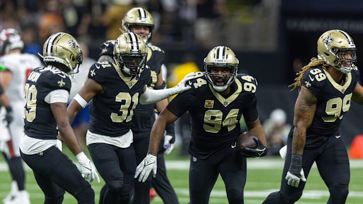 Oct 13, 2024; New Orleans, Louisiana, USA;  New Orleans Saints defensive end Cameron Jordan (94) intercepts Tampa Bay Buccaneers quarterback Baker Mayfield (6) during the first half at Caesars Superdome. Mandatory Credit: Stephen Lew-Imagn Images