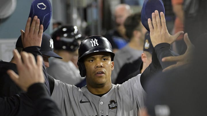 Oct 26, 2024; Los Angeles, California, USA; New York Yankees outfielder Juan Soto (22) celebrates in the dugout after scoring on an RBI single by designated hitter Giancarlo Stanton (not pictured) in the ninth inning against the Los Angeles Dodgers during game two of the 2024 MLB World Series at Dodger Stadium. Mandatory Credit: Jayne Kamin-Oncea-Imagn Images Oct 26, 2024; Los Angeles, California, USA; New York Yankees outfielder Juan Soto (22) celebrates in the dugout after scoring on an RBI single by designated hitter Giancarlo Stanton (not pictured) in the ninth inning against the Los Angeles Dodgers during game two of the 2024 MLB World Series at Dodger Stadium. Mandatory Credit: Jayne Kamin-Oncea-Imagn Images