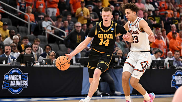 Mar 28, 2026; Houston, TX, USA; Iowa Hawkeyes guard Bennett Stirtz (14) controls the ball against Illinois Fighting Illini guard Keaton Wagler (23) in the first half during the Elite Eight. Mar 28, 2026; Houston, TX, USA; Iowa Hawkeyes guard Bennett Stirtz (14) controls the ball against Illinois Fighting Illini guard Keaton Wagler (23) in the first half during the Elite Eight.