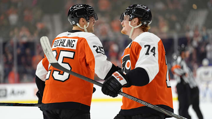 Mar 29, 2025; Philadelphia, Pennsylvania, USA; Philadelphia Flyers center Ryan Poehling (25) reacts with right wing Owen Tippett (74) after scoring a goal against the Buffalo Sabres in the third period at Wells Fargo Center. Mandatory Credit: Kyle Ross-Imagn Images
