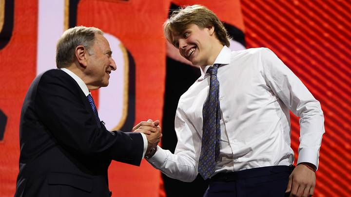 Jun 26, 2026; Buffalo, New York, USA; Nikita Klepov reacts beside NHL commissioner Gary Bettman after being selected with the fifteenth pick in the first round of the 2026 NHL Draft by the Anaheim Ducks at KeyBank Center. Mandatory Credit: Timothy T. Ludwig-Imagn Images