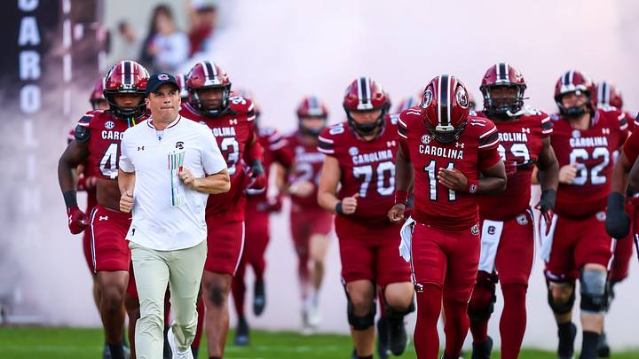 Nov 22, 2025; Columbia, South Carolina, USA; South Carolina Gamecocks head coach Shane Beamer leads his team onto the field before their game against the Coastal Carolina Chanticleers at Williams-Brice Stadium. Mandatory Credit: Jeff Blake-Imagn Images