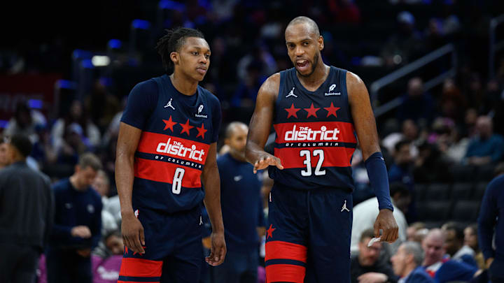 Mar 5, 2025; Washington, District of Columbia, USA; Washington Wizards forward Khris Middleton (32) and guard Bub Carrington (8) talk during the third quarter against the Utah Jazz at Capital One Arena. Mandatory Credit: Reggie Hildred-Imagn Images