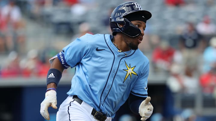 Feb 25, 2025; Port Charlotte, Florida, USA;  Tampa Bay Rays outfielder Chandler Simpson (96) singles against the Philadelphia Phillies during the third inning at Charlotte Sports Park. Mandatory Credit: Kim Klement Neitzel-Imagn Images