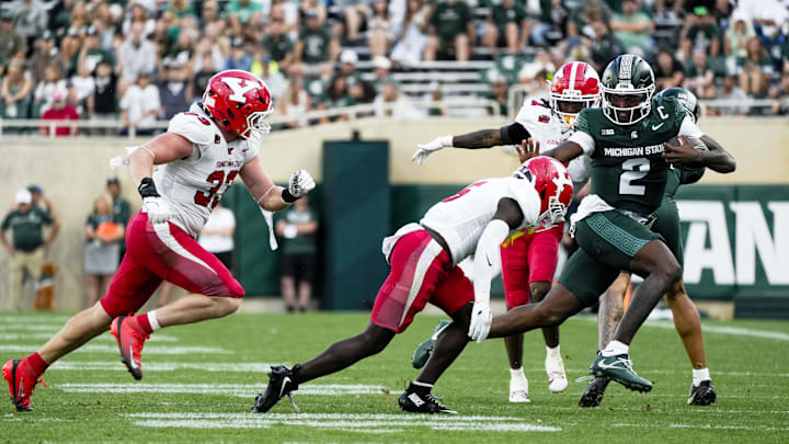 Sep 13, 2025; East Lansing, Michigan, USA; Michigan State quarterback Aidan Chiles (2) runs with the ball against Youngstown State in the fourth quarter at Spartan Stadium. Mandatory Credit: Brendan Mullin-Imagn Images