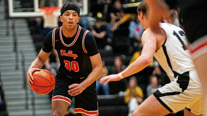 Valley's Curtis Stinson looks for a teammate to pass to Friday, Dec. 8, 2023, at Centennial.