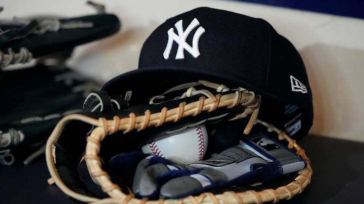A look at a New York Yankees hat sitting on top of a baseball glove before a game against the Milwaukee Brewers. A look at a New York Yankees hat sitting on top of a baseball glove before a game against the Milwaukee Brewers.