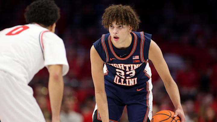 Dec 9, 2025; Columbus, Ohio, USA; Illinois Fighting Illini guard Keaton Wagler (23) handles the ball as Ohio State Buckeyes guard John Mobley Jr. (0) defends during the first halfat Value City Arena. Mandatory Credit: Joseph Maiorana-Imagn Images