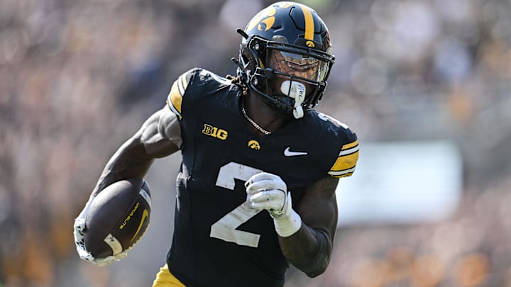 Oct 12, 2024; Iowa City, Iowa, USA; Iowa Hawkeyes running back Kaleb Johnson (2) runs for a 17 yard touchdown run during the second quarter against the Washington Huskies at Kinnick Stadium. Mandatory Credit: Jeffrey Becker-Imagn Images