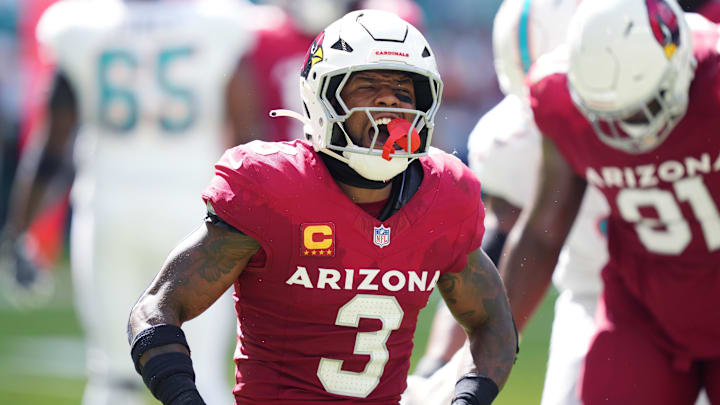 Oct 27, 2024; Miami Gardens, Florida, USA; Arizona Cardinals safety Budda Baker (3) celebrates tackling Miami Dolphins wide receiver Jaylen Waddle (17) for a short gain in the thirdquarter at Hard Rock Stadium. Mandatory Credit: Jim Rassol-Imagn Images