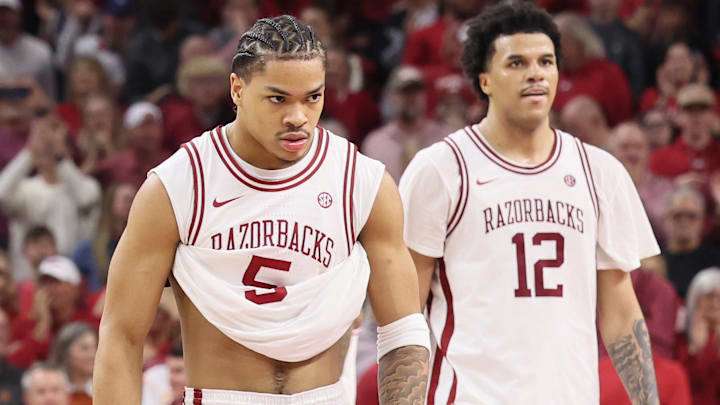 Arkansas Razorbacks guard Darius Acuff Jr (5) celebrates after a play against the Tennessee Volunteers during the second half as forward Malique Ewin (12) looks on at Bud Walton Arena.  