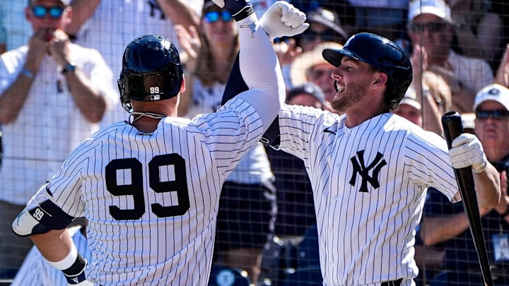 New York Yankees right fielder Aaron Judge (99) celebrates a 2-run home run against Detroit Tigers with third baseman Ryan McMahon (19) during the fourth inning at George M. Steinbrenner Field in Tampa, Fla. on Saturday, Feb. 21, 2026.