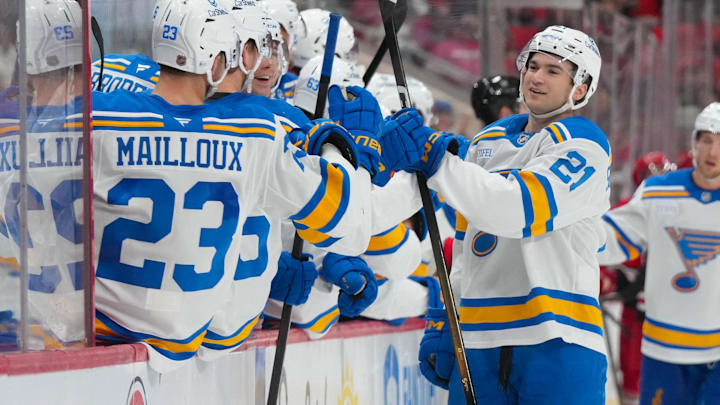 Mar 12, 2026; Raleigh, North Carolina, USA;  St. Louis Blues right wing Jimmy Snuggerud (21) celebrates his goal against the Carolina Hurricanes during the third period at Lenovo Center. Mandatory Credit: James Guillory-Imagn Images