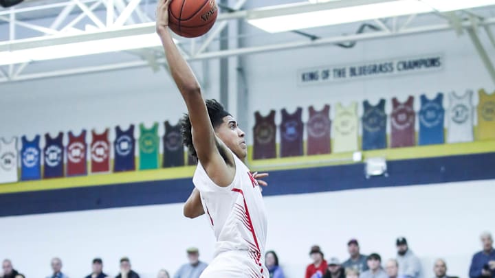 Newport's Taylen Kinney (0) goes up for two of his 13 points 