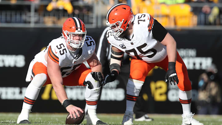Dec 8, 2024; Pittsburgh, Pennsylvania, USA;  Cleveland Browns guard Joel Bitonio (75) talks with center Ethan Pocic (55) at the line of scrimmage against the Pittsburgh Steelers during the second quarter at Acrisure Stadium. Mandatory Credit: Charles LeClaire-Imagn Images