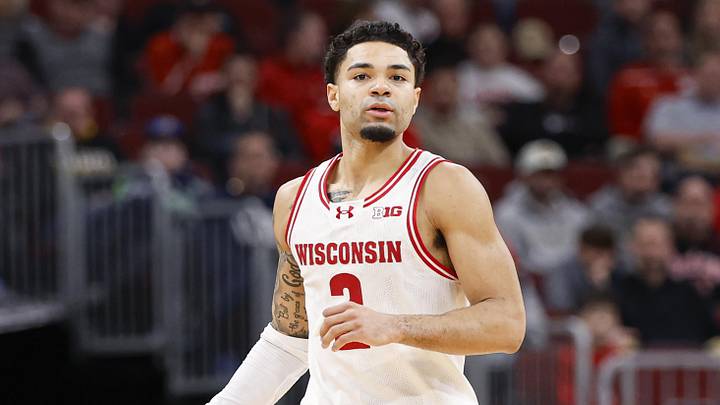 Mar 12, 2026; Chicago, IL, USA; Wisconsin Badgers guard Nick Boyd (2) brings the ball up court against the Washington Huskies during the second half at United Center. Mandatory Credit: Kamil Krzaczynski-Imagn Images