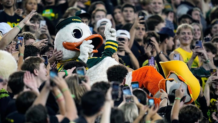 Oct 12, 2024; Eugene, Oregon, USA; The Oregon Duck mascot celebrates with fans in the second half against Ohio State Buckeyes during the NCAA football game at Autzen Stadium.