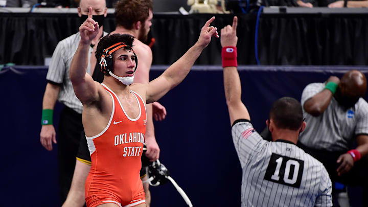 Mar 19, 2021; St. Louis, Missouri, USA;  Oklahoma State Cowboys wrestler AJ Ferrari celebrates after defeating Iowa Hawkeyes wrestler Jacob Warner in the 197 weight class during the quarterfinals of the NCAA Division I Wrestling Championships at Enterprise Center.