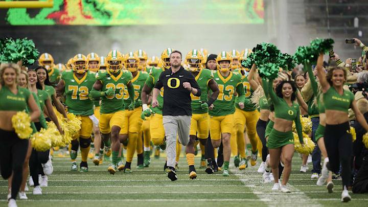 Nov 9, 2024; Eugene, Oregon, USA; Oregon Ducks head coach Dan Lanning leads his team before the start of a game against the Maryland Terrapins at Autzen Stadium. Mandatory Credit: Troy Wayrynen-Imagn Images