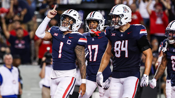 Aug 30, 2025; Tucson, Arizona, USA; Arizona Wildcats quarterback Noah Fifita (1) points up to the sky after scoring a touchdown during the third quarter of the game against the Hawaii Rainbow Warriors at Arizona Stadium. Mandatory Credit: Aryanna Frank-Imagn Images